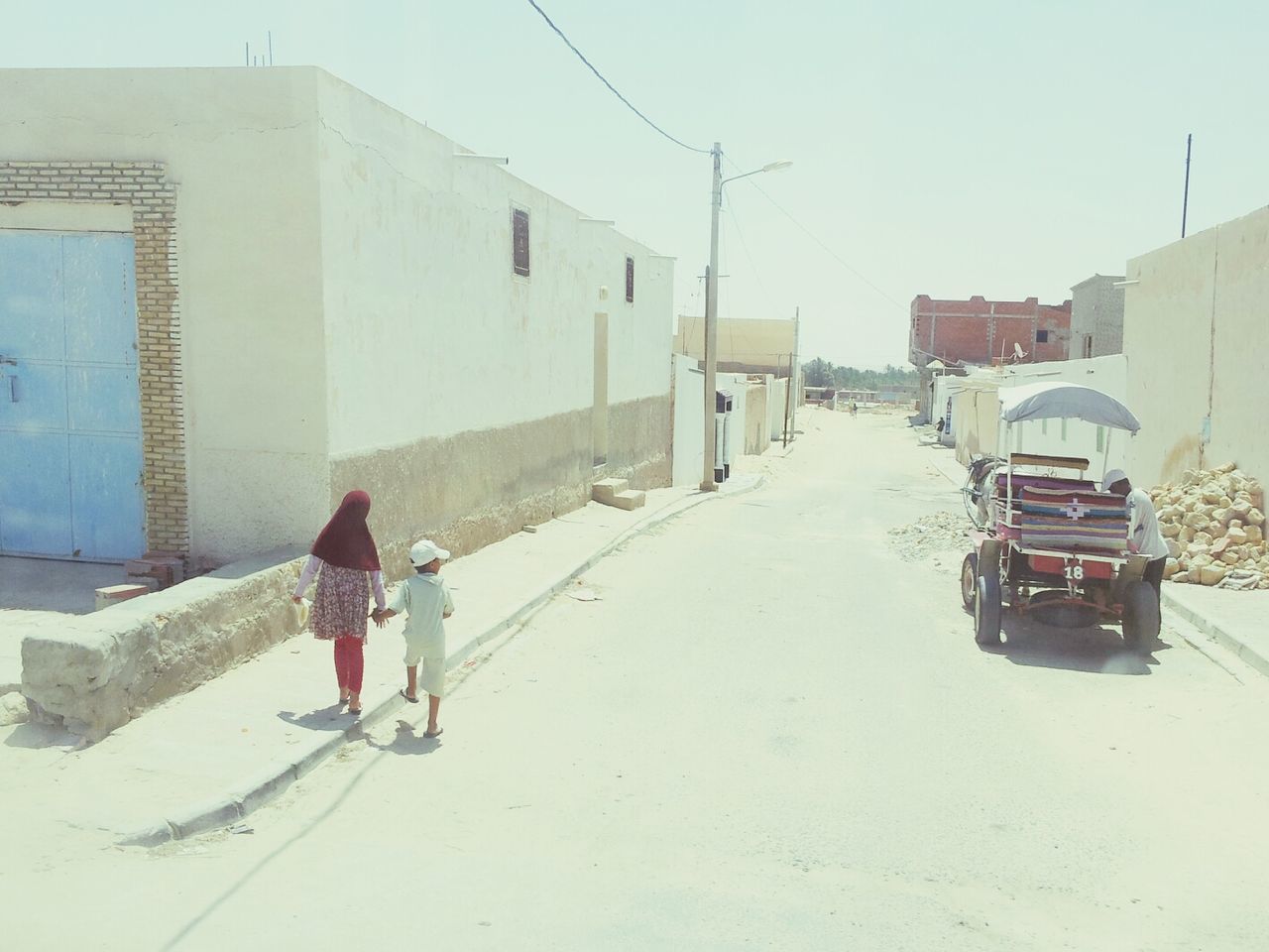 WOMAN STANDING ON SIDEWALK