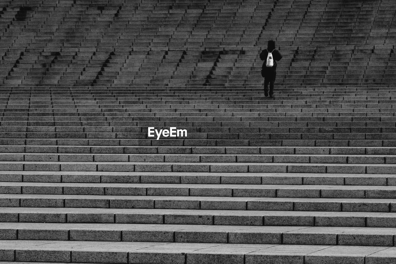 Person standing on steps 