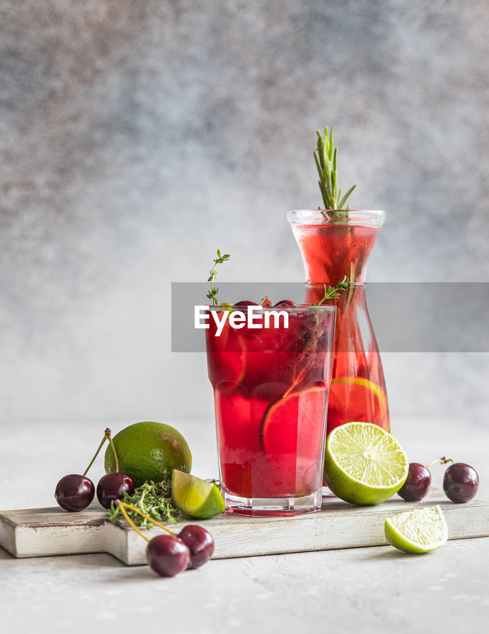 Lemonade or non-alcohol cocktail with cherry and lime. summer refreshment drink.