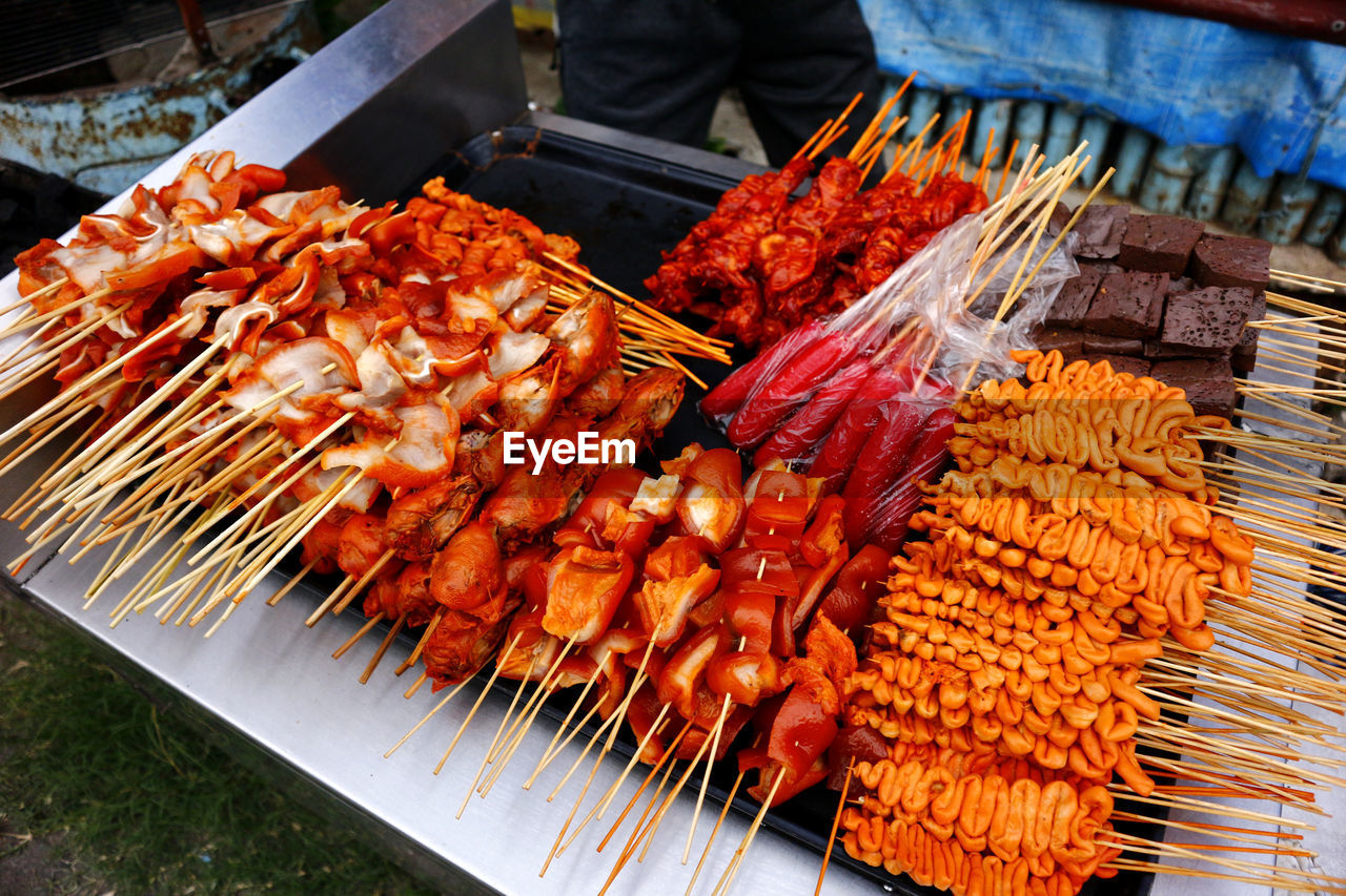 Photo of assorted grilled pork and chicken innards barbecue at a street food stall