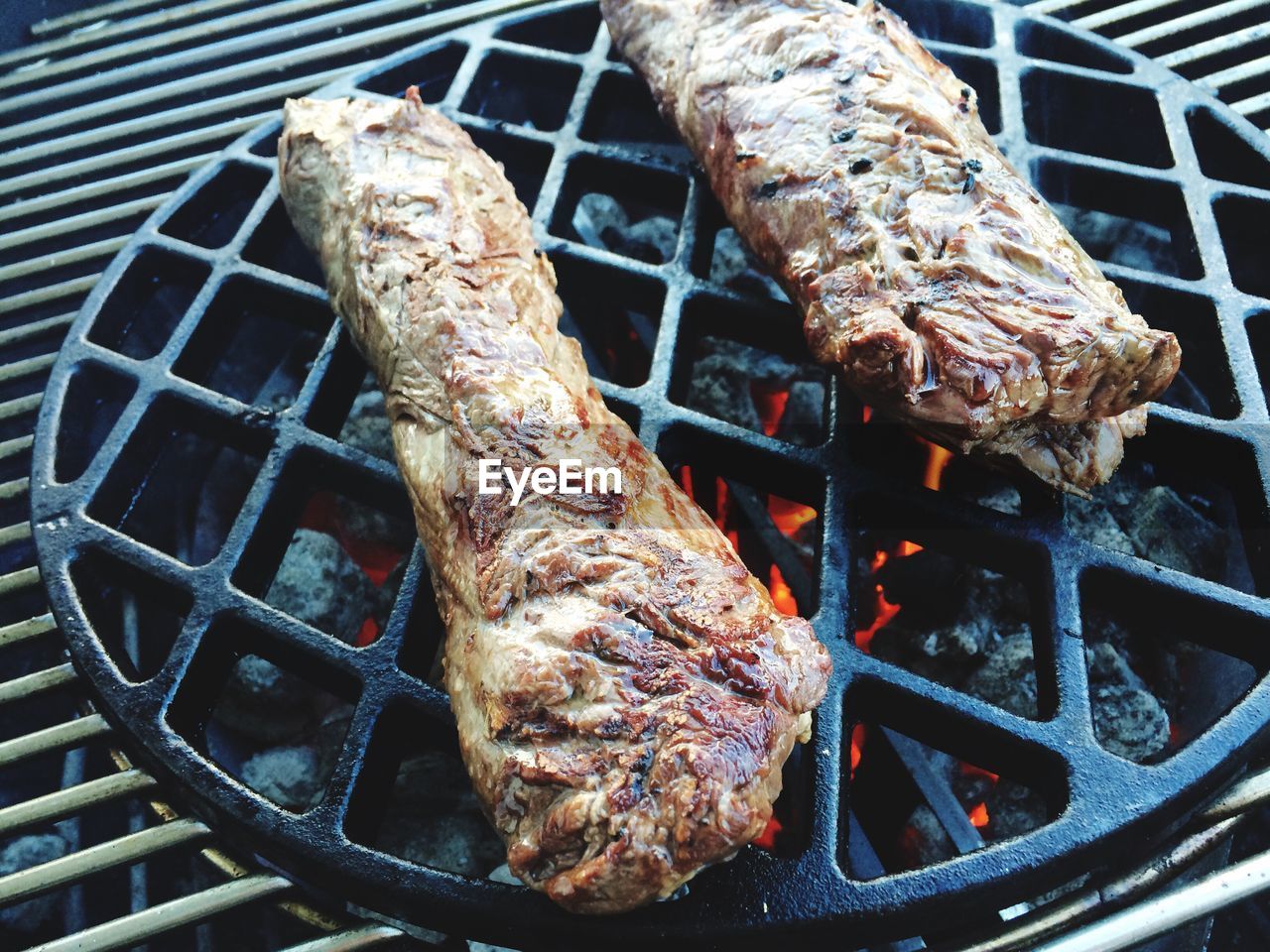 Close-up of meat on barbecue grill