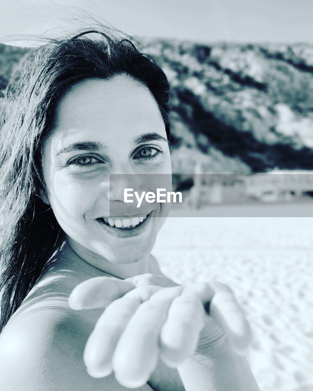 portrait, one person, white, smiling, adult, women, portrait photography, looking at camera, happiness, young adult, emotion, female, headshot, nature, teeth, black and white, leisure activity, photo shoot, smile, lifestyles, person, cheerful, water, day, human face, blue, monochrome photography, hand, skin, snow, outdoors, focus on foreground, hairstyle, monochrome, holiday, long hair, beach, close-up, front view, vacation, holding, sea, trip, land, sky, positive emotion, enjoyment, clothing