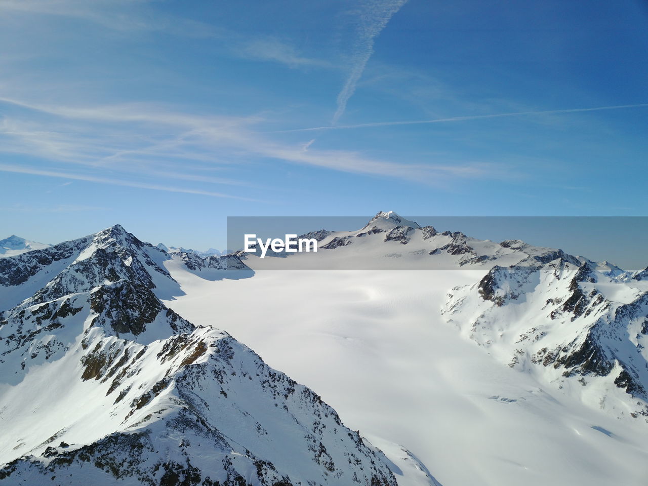 SNOWCAPPED MOUNTAINS AGAINST SKY