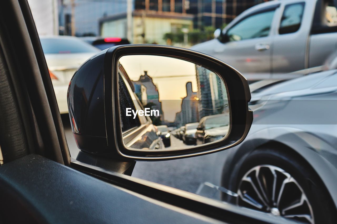 Reflection of car on side-view mirror