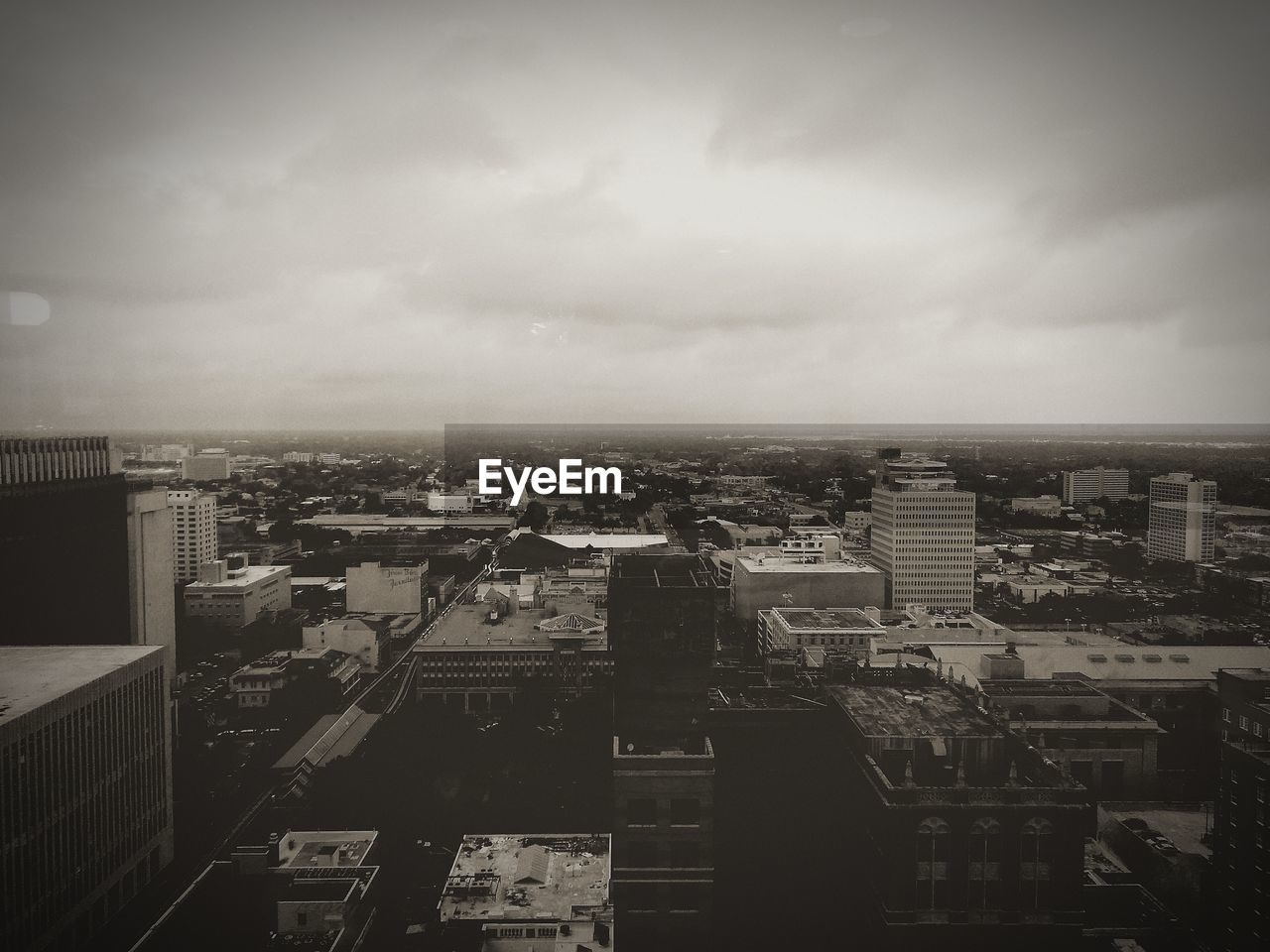 HIGH ANGLE VIEW OF CITYSCAPE AND SKY