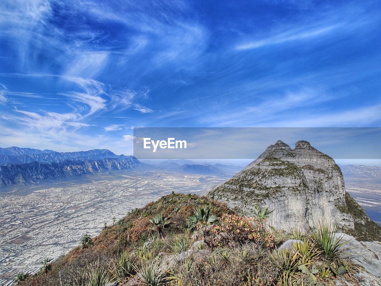 PANORAMIC VIEW OF ROCKS AND MOUNTAINS AGAINST SKY