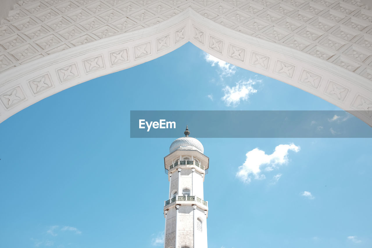 Low angle view of historical mosque building against sky