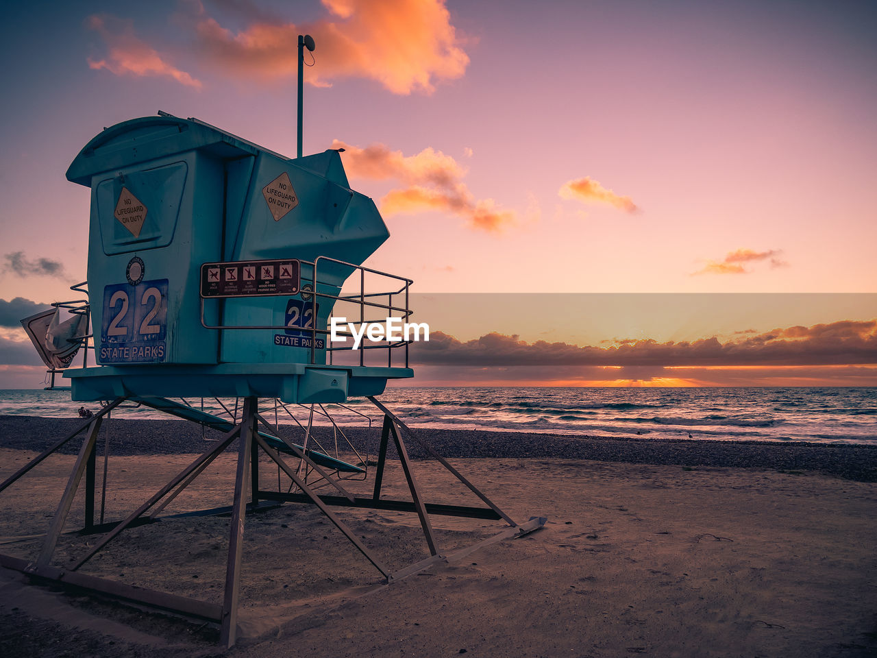 Lifeguard tower at carlsbad, california beach at sunset.