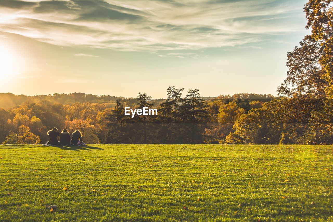 Scenic view of field against sky during sunset