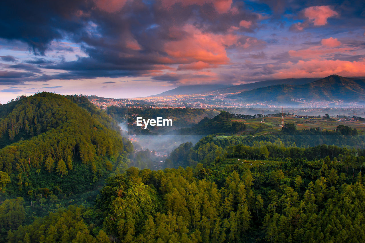 Scenic view of landscape against sky during sunrise