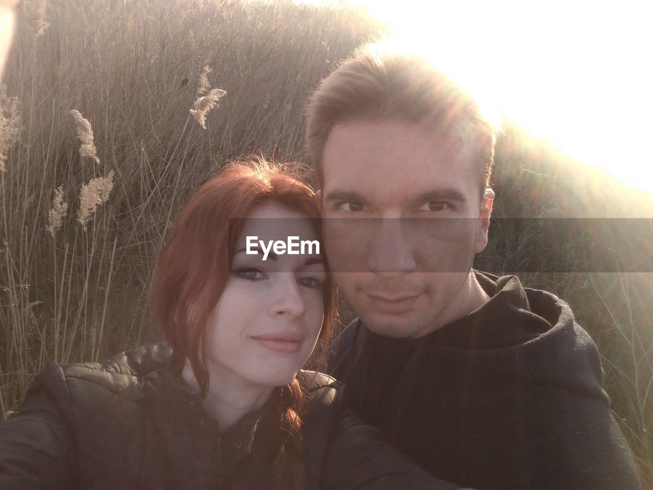 PORTRAIT OF HAPPY YOUNG COUPLE