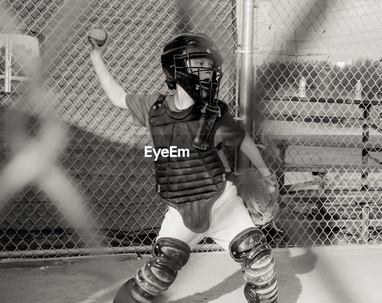 Boy throwing ball while playing baseball