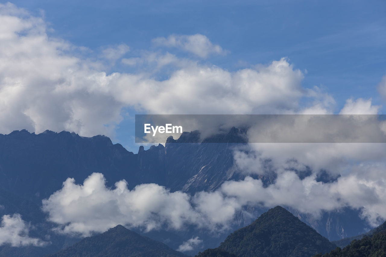 Low angle view of mountain range against sky