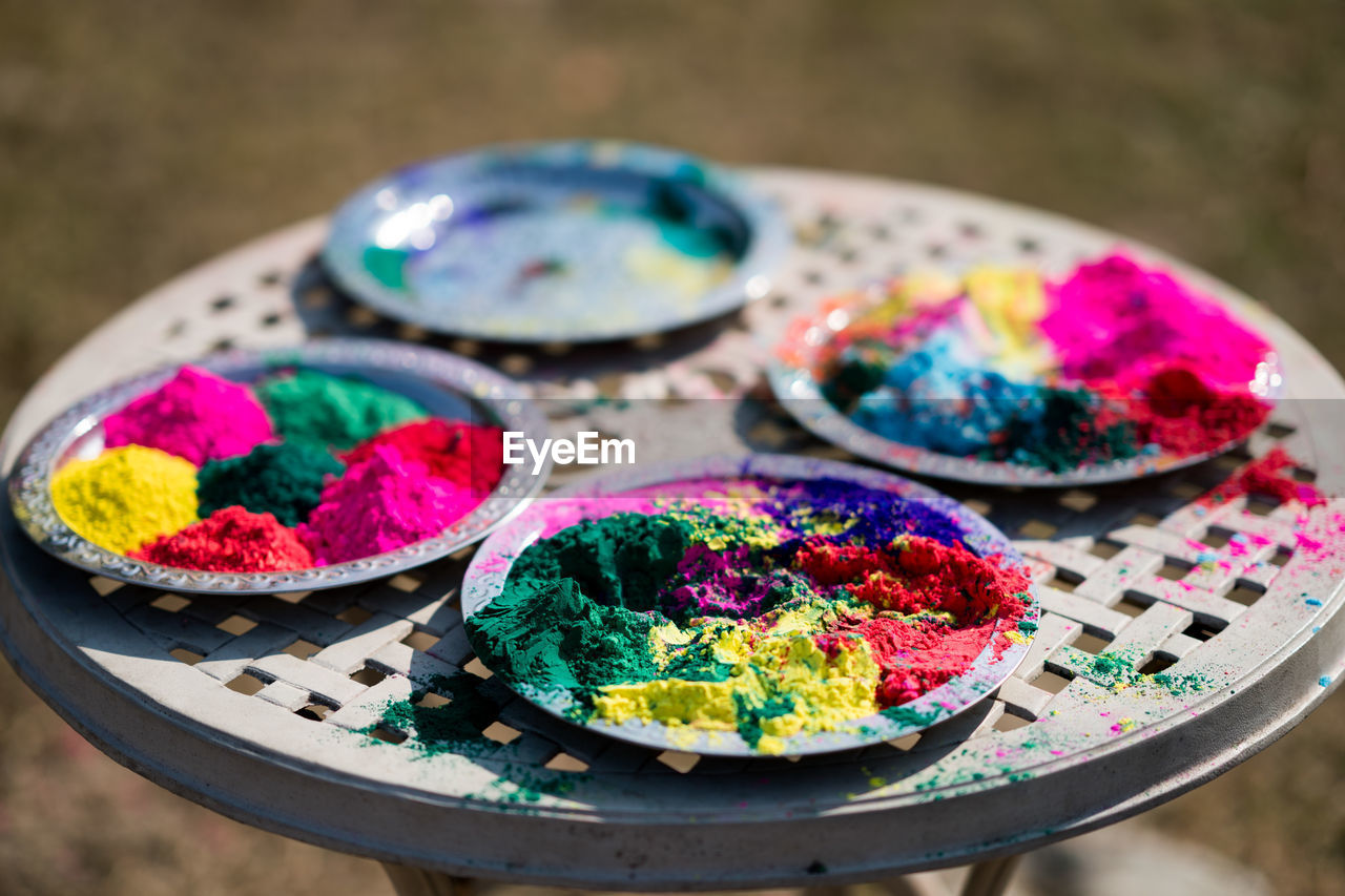 Close-up of multi colored powder on table