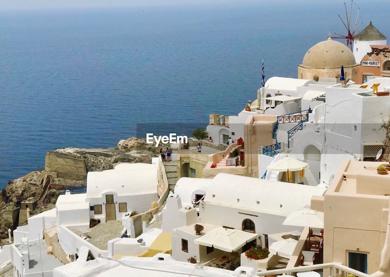 HIGH ANGLE VIEW OF BUILDINGS AT SEASIDE