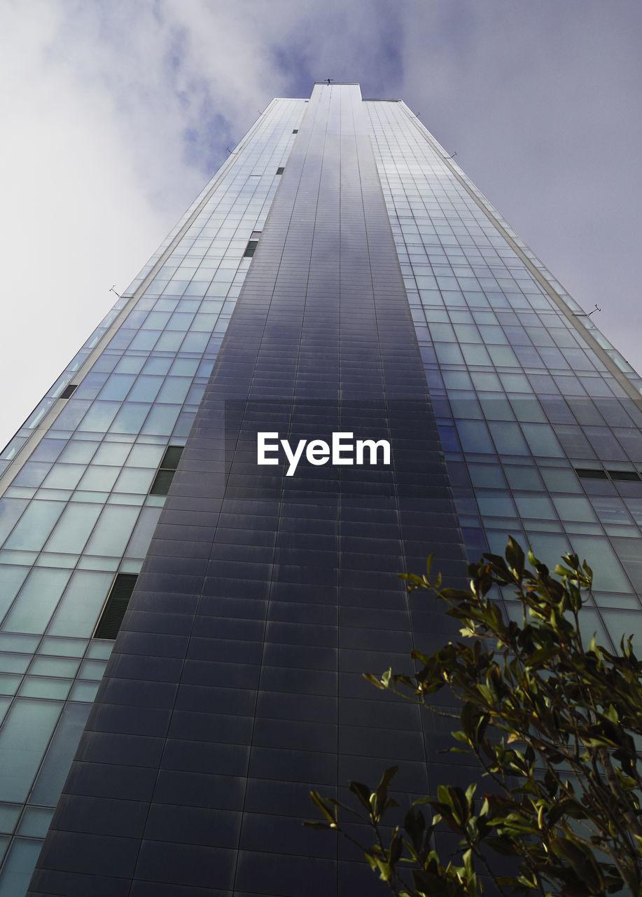 LOW ANGLE VIEW OF MODERN BUILDINGS AGAINST SKY