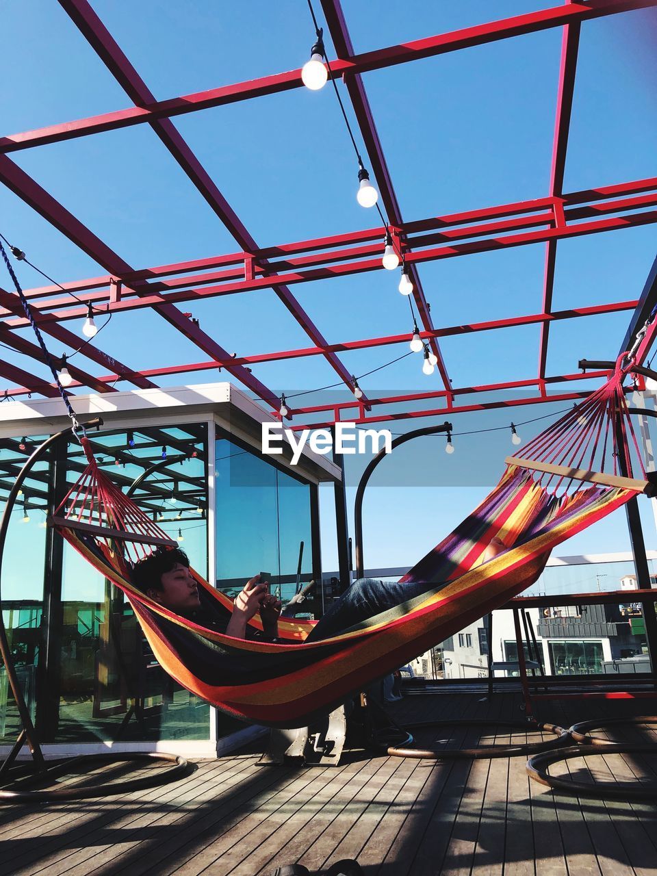 Man lying in hammock