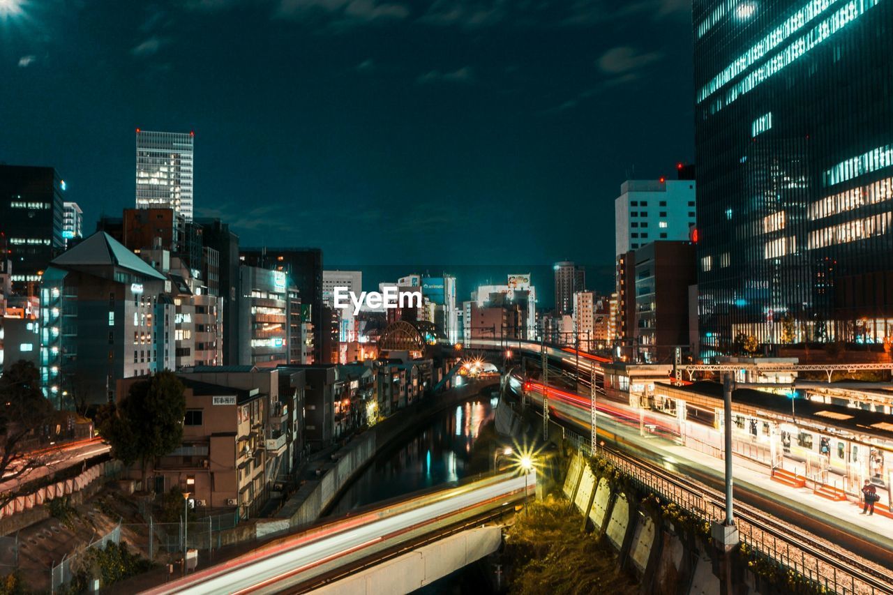 Light trails on road in city at night