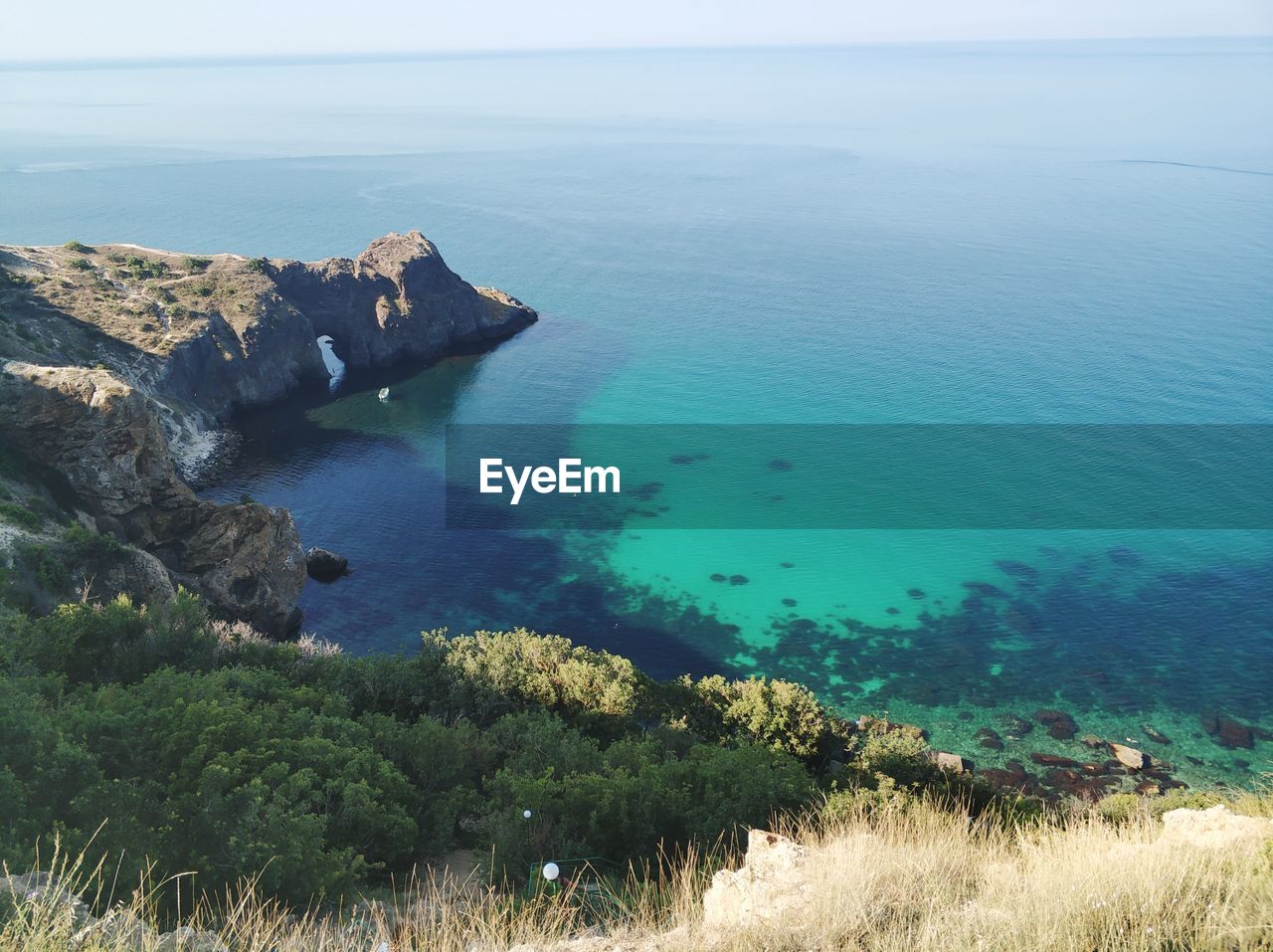 HIGH ANGLE VIEW OF BAY AND SEA