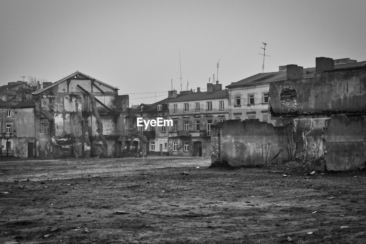 ABANDONED BUILDINGS AGAINST CLEAR SKY