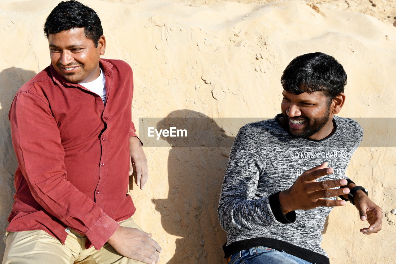 Cheerful friends enjoying at desert