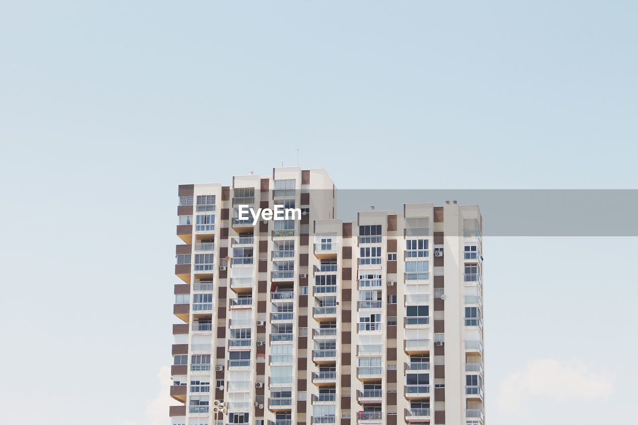 Low angle view of building in city against sky