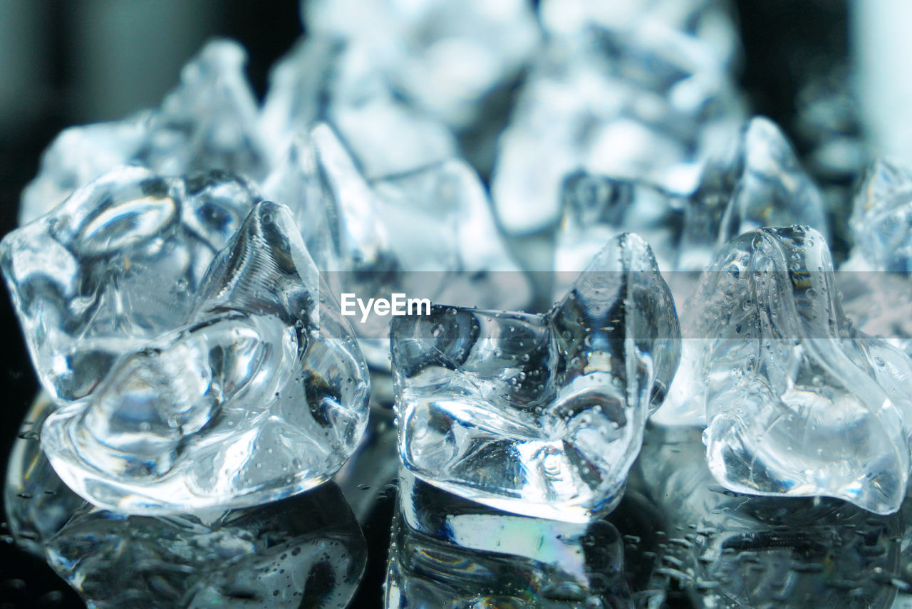 Group of ices with water on the slick ground.