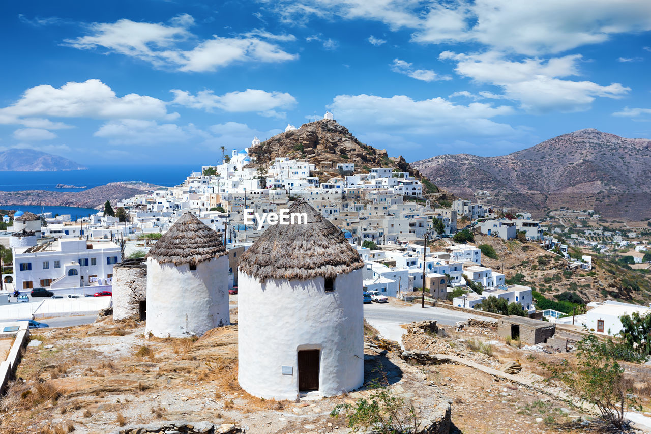Townscape and mountain against sky