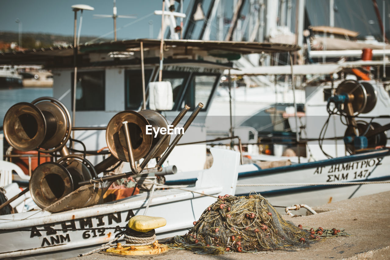 Fishing boats moored at harbor