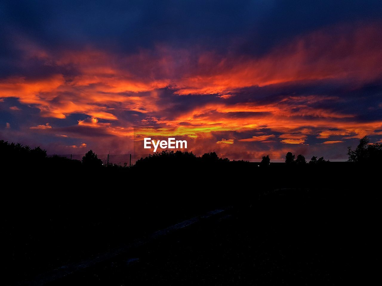 SILHOUETTE OF LANDSCAPE AT SUNSET