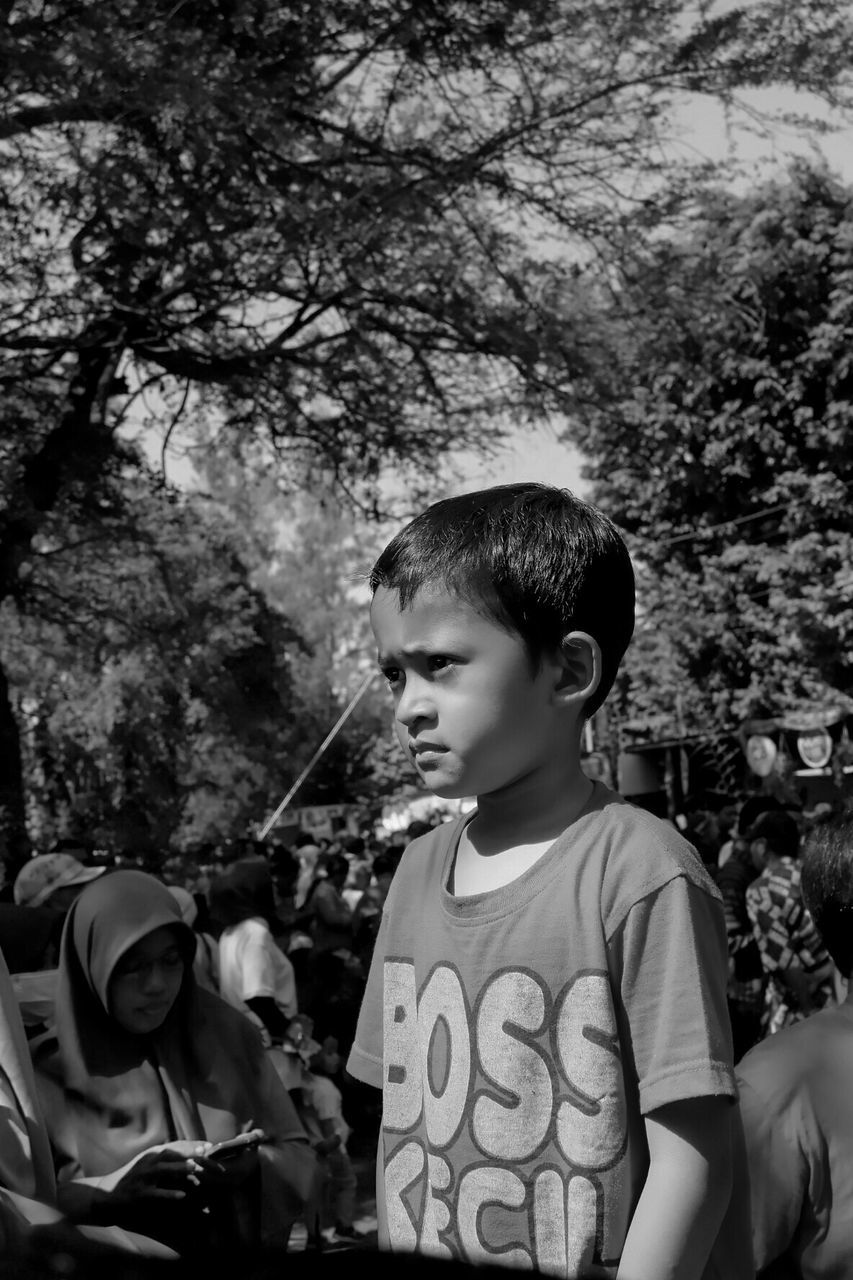 PORTRAIT OF BOY LOOKING DOWN