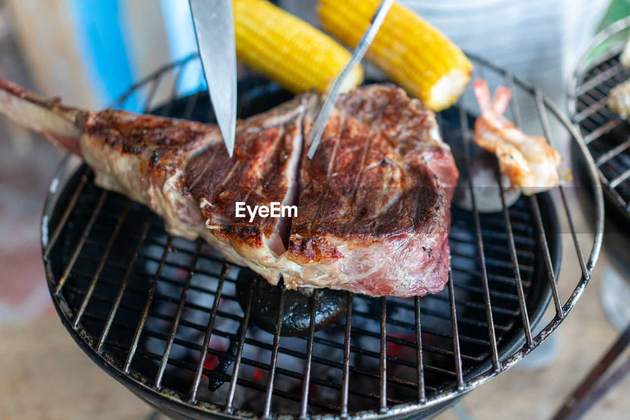 Close-up of  meat on barbecue grill