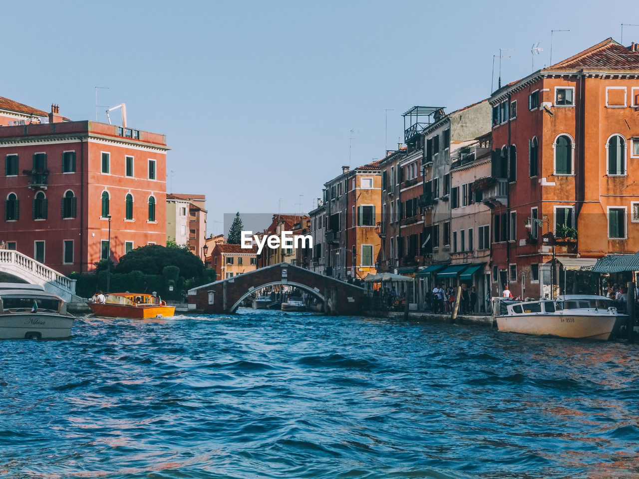 Grand canal amidst buildings against sky in city