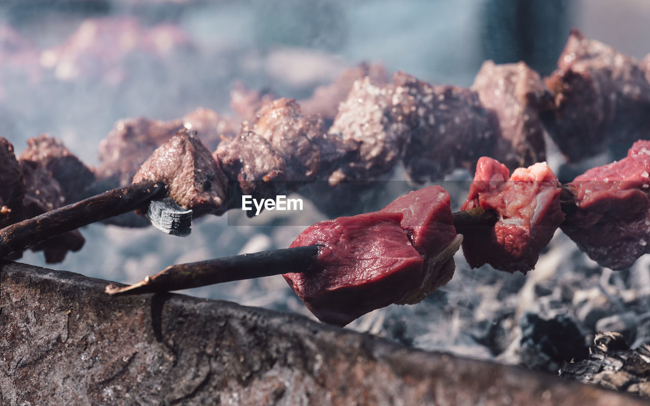 Close-up of meat on grill