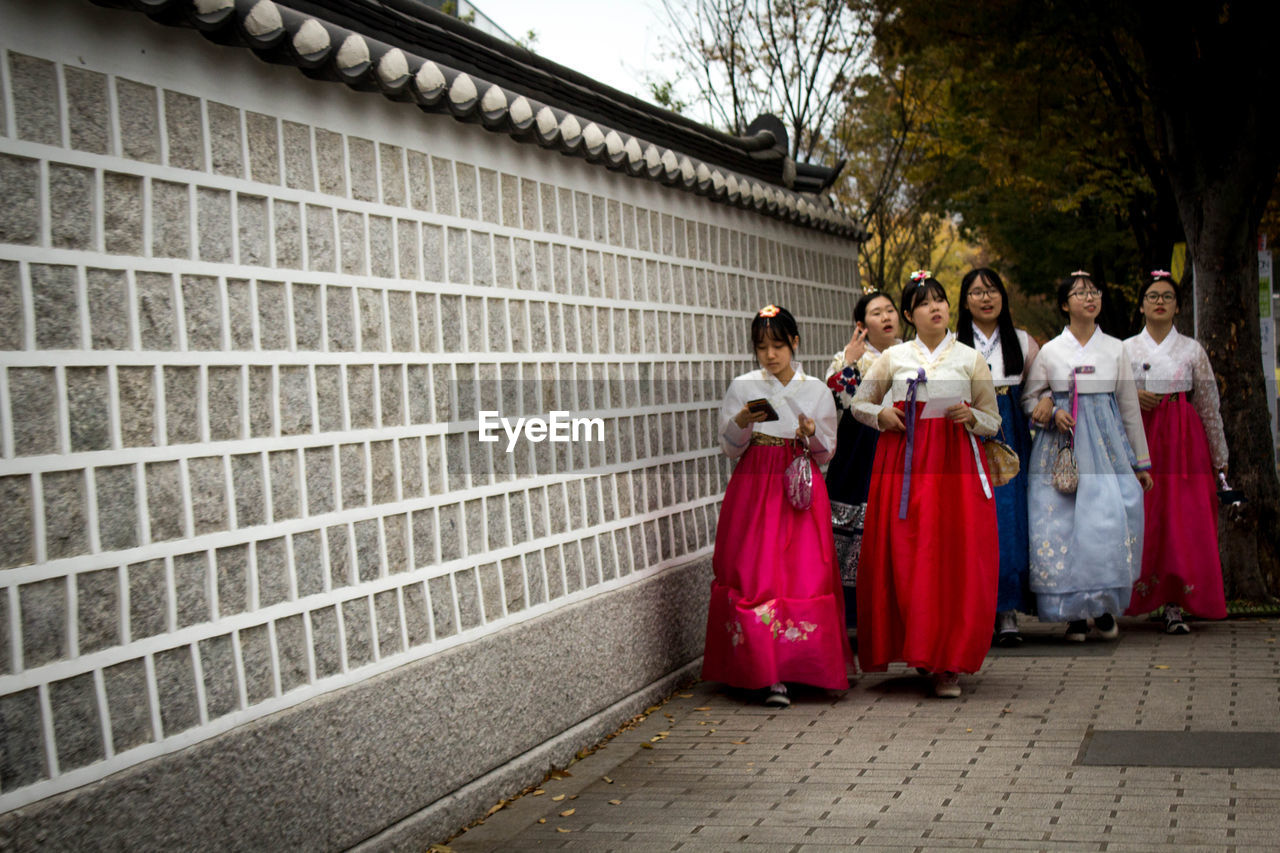 WOMEN WALKING ON WOODEN FLOOR