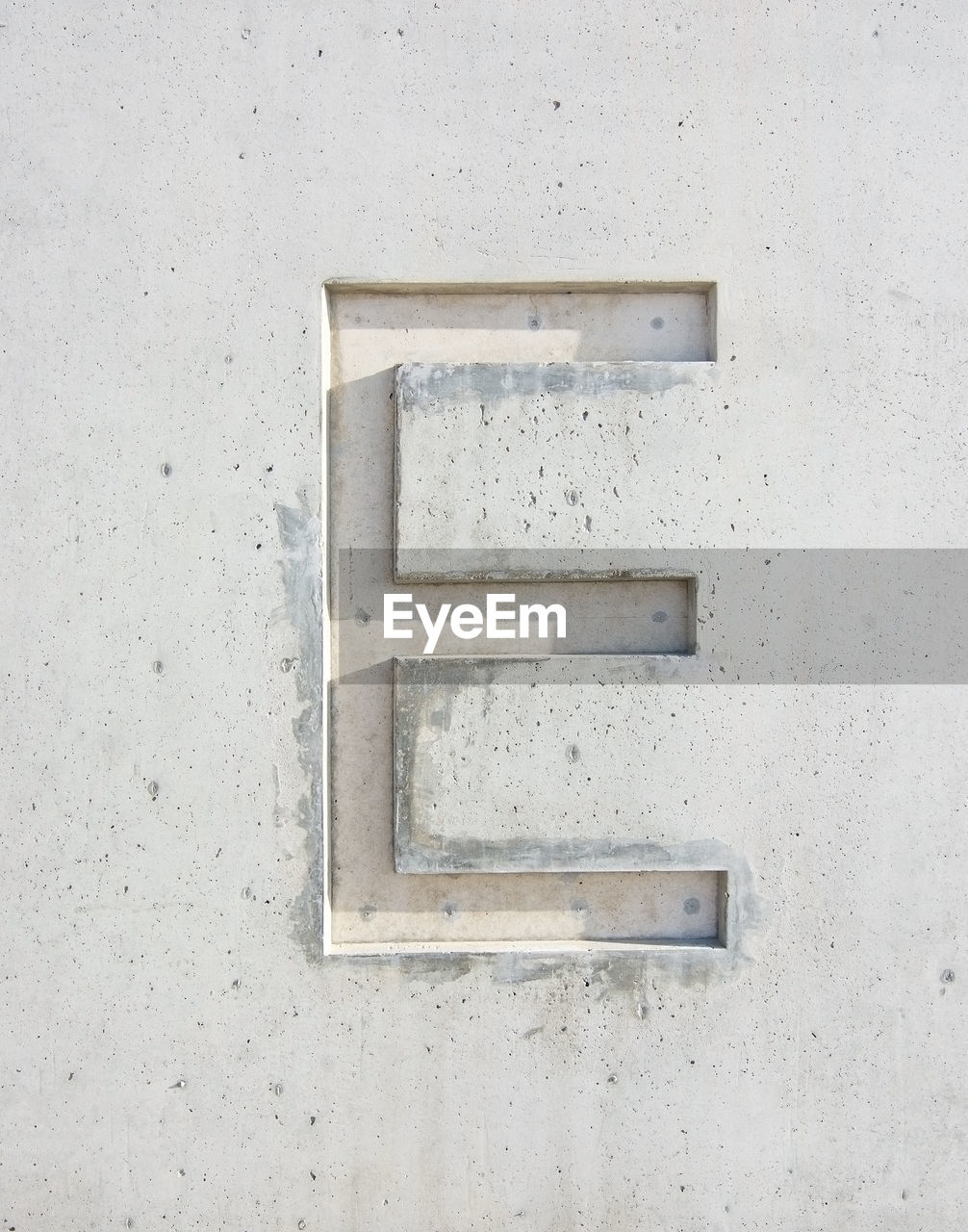 Close-up of letter e on white wall