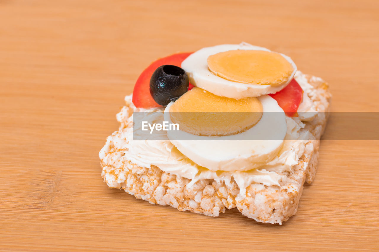 food and drink, food, icing, sweet food, dessert, wood, fruit, sweet, freshness, healthy eating, breakfast, baked, produce, indoors, dish, table, no people, cake, birthday cake, meal, still life, egg