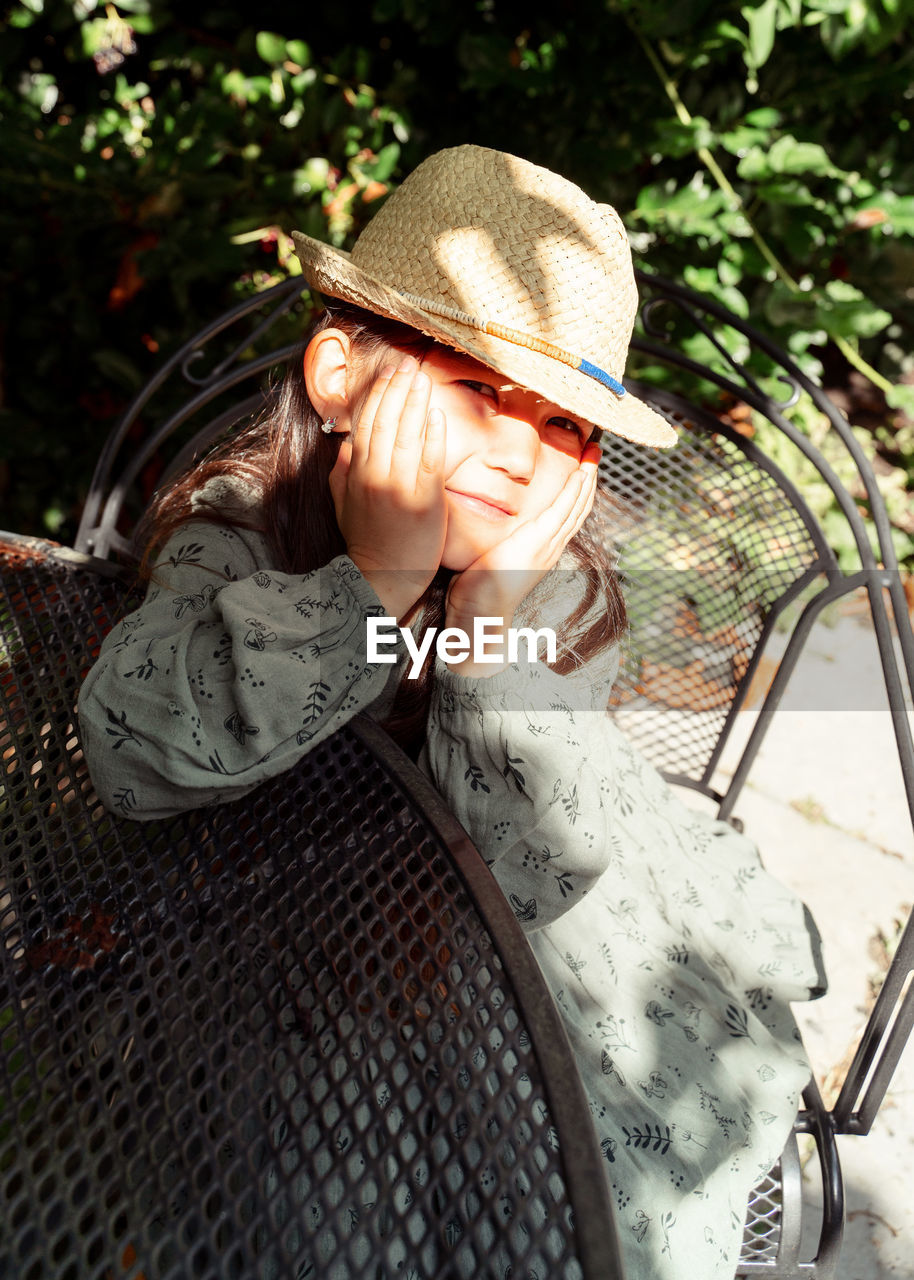 Portrait of girl wearing hat and looking at camera