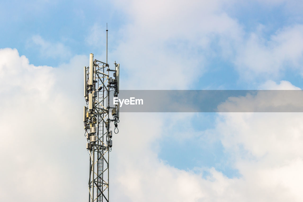 Low angle view of communications tower against sky