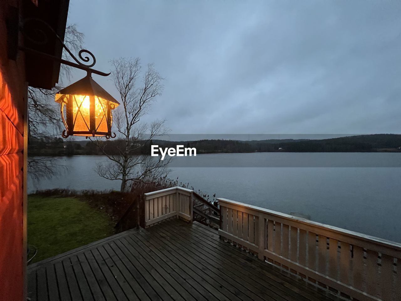 BUILT STRUCTURE BY LAKE AGAINST SKY