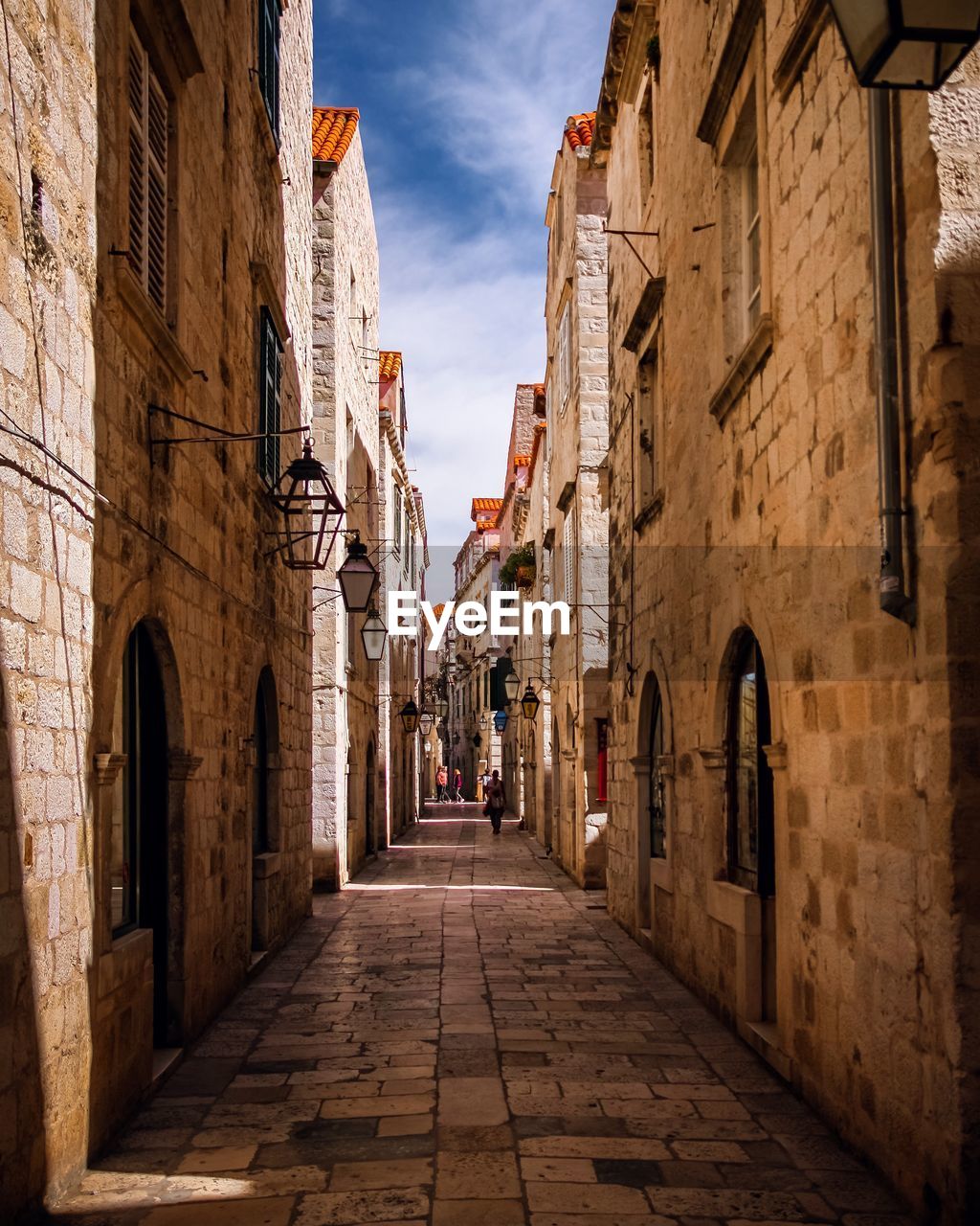 NARROW ALLEY AMIDST OLD BUILDINGS