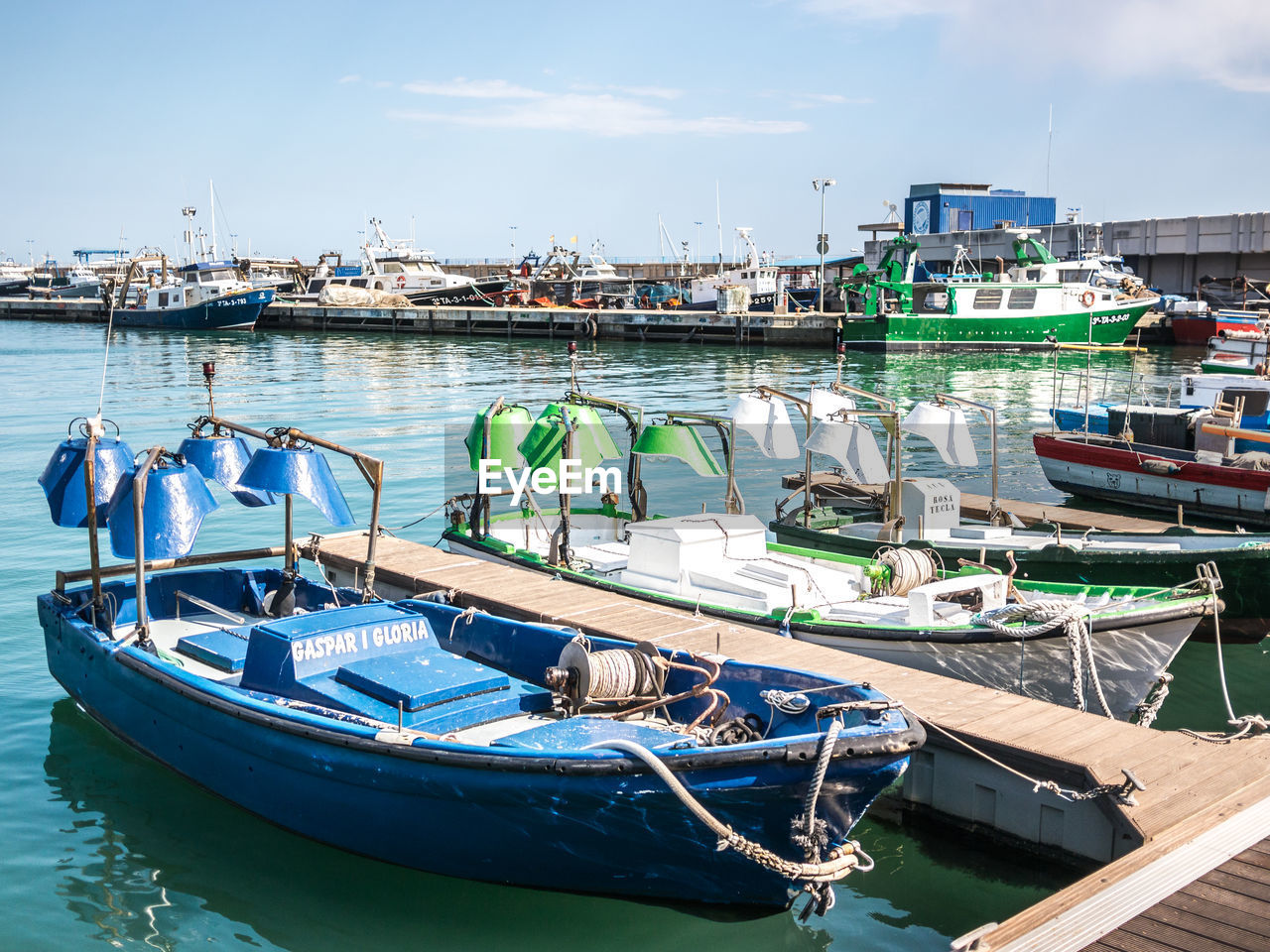 BOATS MOORED IN HARBOR