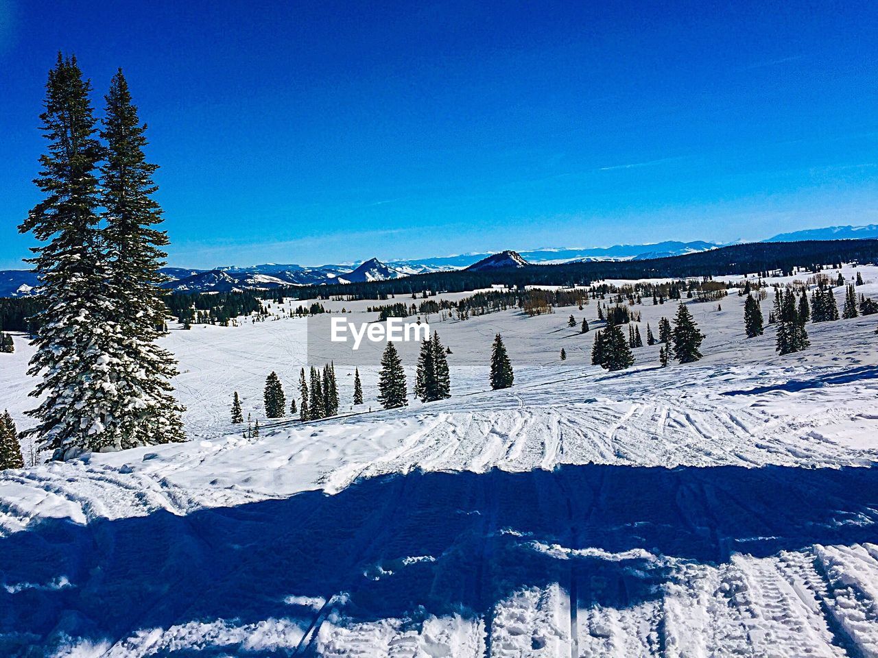 SNOW COVERED LANDSCAPE AGAINST SKY