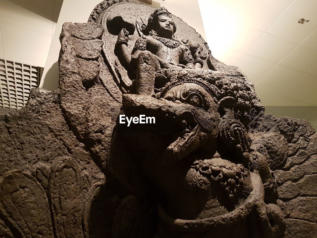 CLOSE-UP LOW ANGLE VIEW OF STATUE