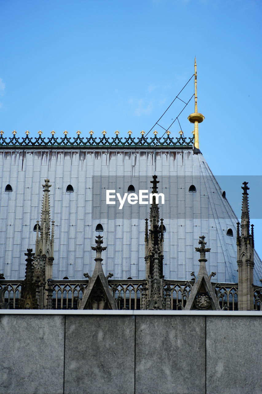 Low angle view of building against blue sky