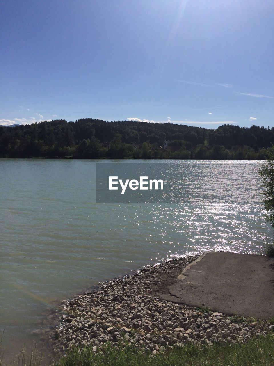 SCENIC VIEW OF LAKE BY TREES AGAINST SKY