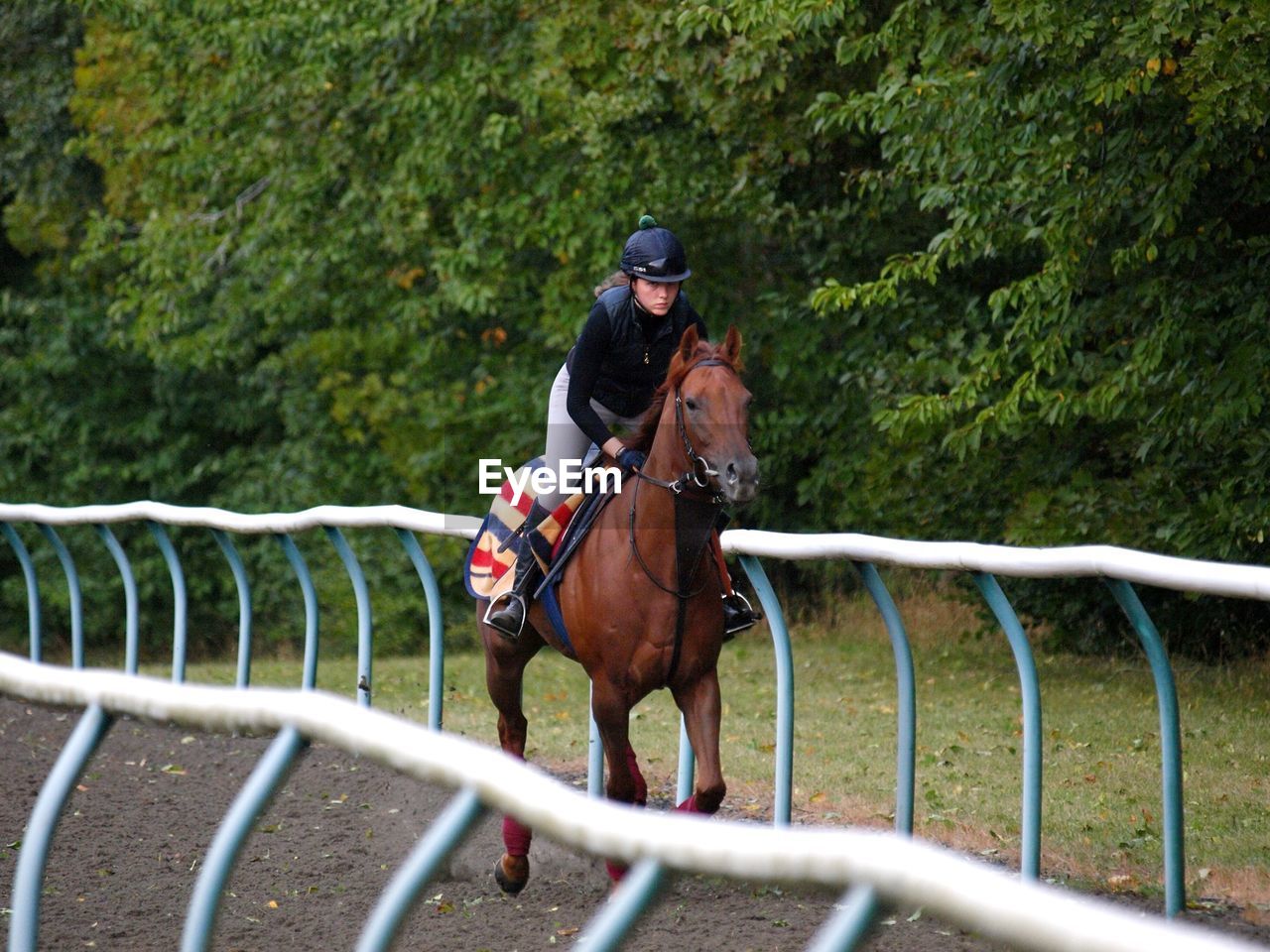 FULL LENGTH OF A MAN RIDING HORSE ON LANDSCAPE