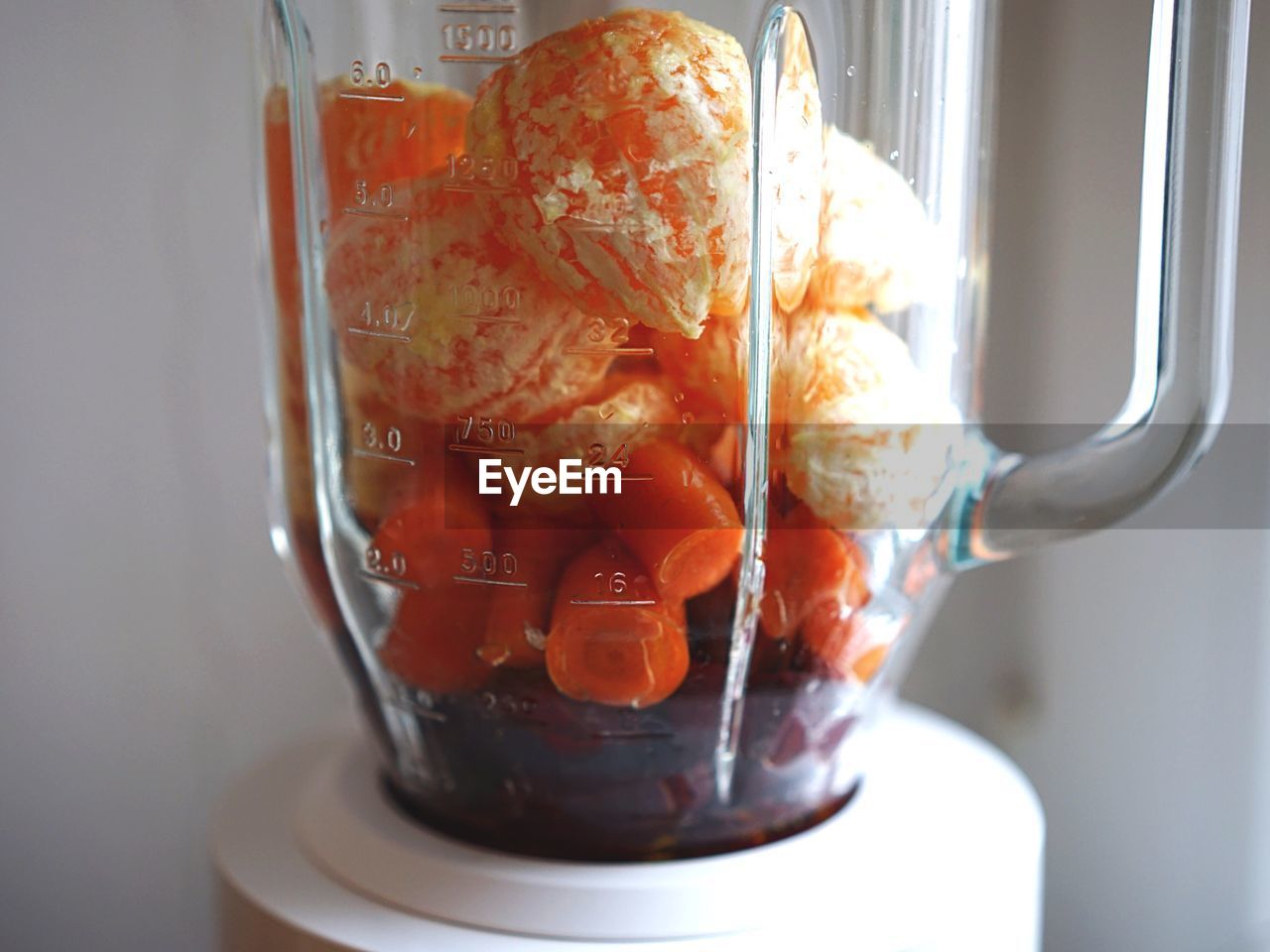 Close-up of fruits in electric juicer