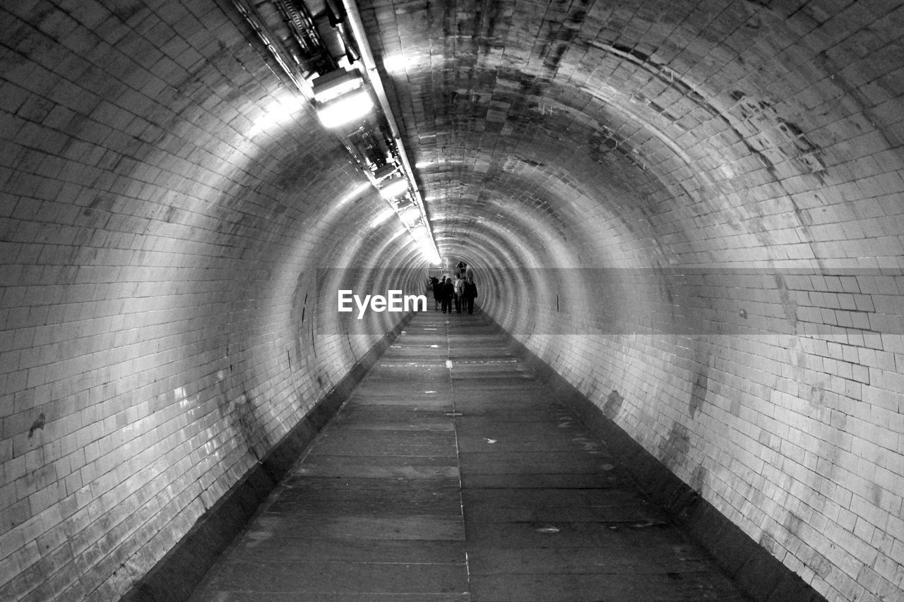 Man walking in subway tunnel