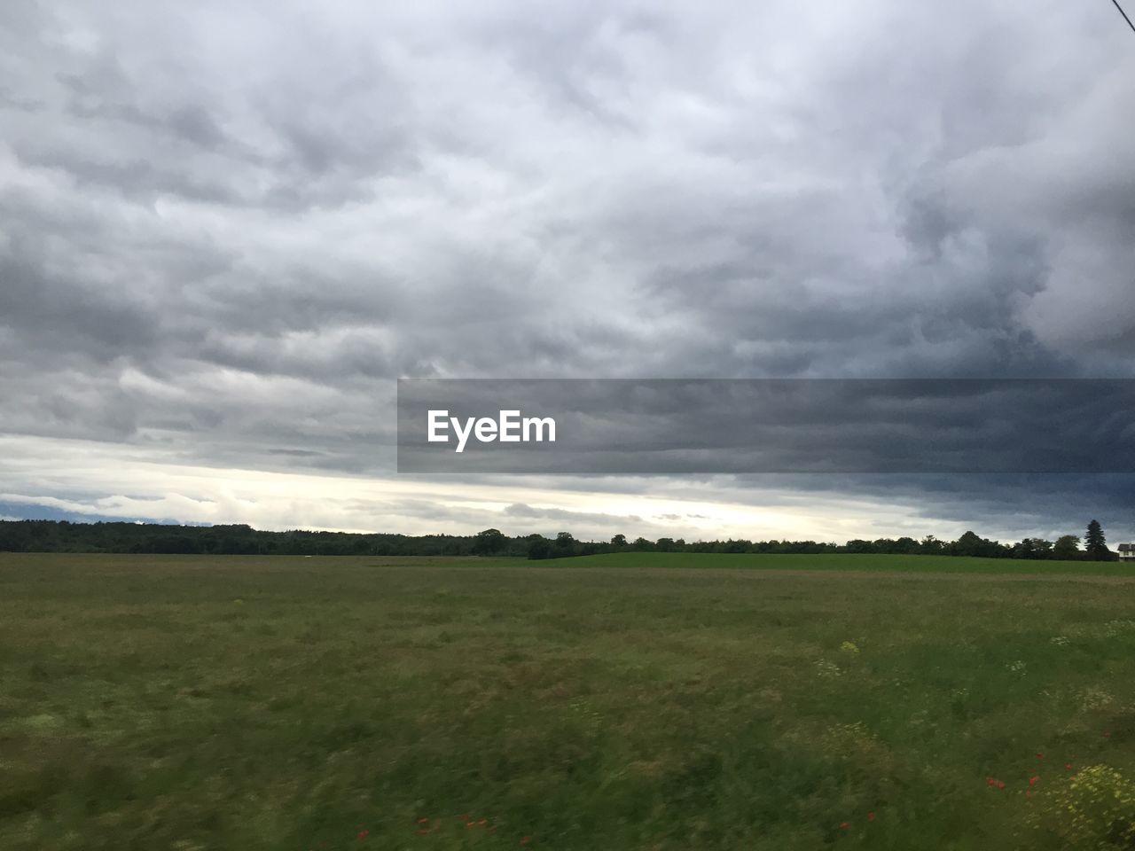 SCENIC VIEW OF LANDSCAPE AGAINST CLOUDY SKY